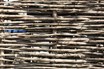 Woven from willow twigs fence texture