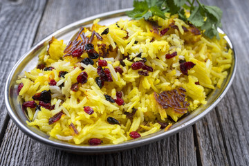 Traditional Iranian Tahdig with Berberis as cloe-up in a bowl