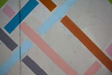 Wall with orange, blue,  pink, purple lines