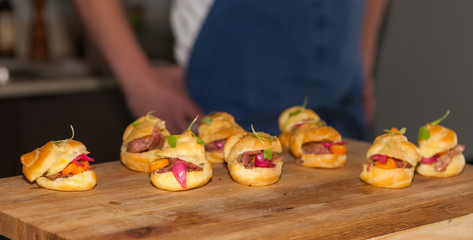 Salmon Sliders on wooden plank