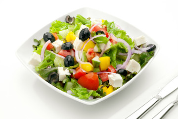 close up view of nice yummy salad on white back