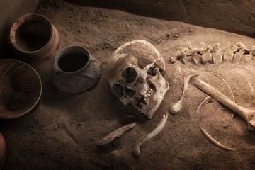 Ancient skeleton lying in grave