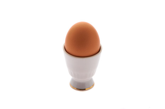 Egg on a stand on a white isolated background