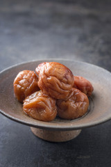 Traditional Japanese Umeboshi as close-up in a bowl