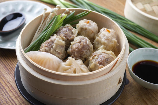 Traditional Chinese Dim Sum as close-up in a bamboo steamer
