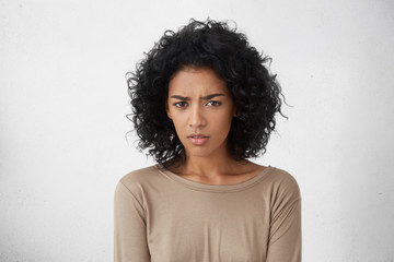 Human facial expressions, emotions, feelings and life perception. Good looking young dark-skinned...