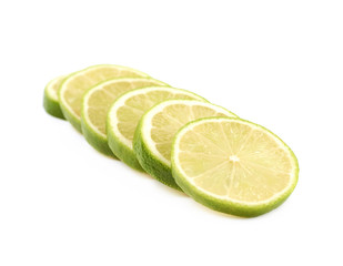 Fototapeta na wymiar Pile of multiple lime slices isolated