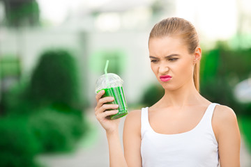 Young woman drink smoothie healthy detox outdoors