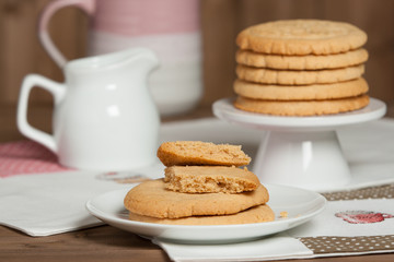 Fototapeta na wymiar Home Baked Peanut Butter Cookies. Handmade Cross Stitch Lunch Mats.