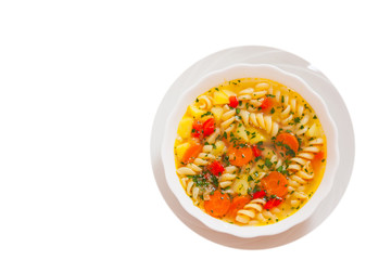 Fresh vegetable soup with pasta. top view. isolated on white