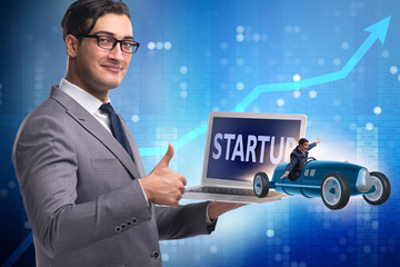 Start-up concept with businessman driving car