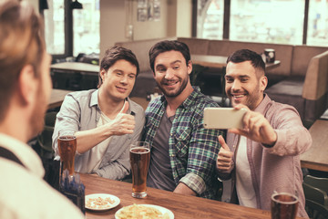 Friends having fun in pub