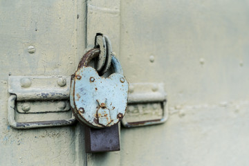 The old door locked with a padlock hanging brackets. Set of backgrounds