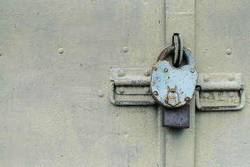 The old door locked with a padlock hanging brackets. Set of backgrounds