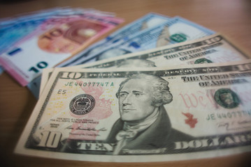Dollar and euro banknotes on a table
