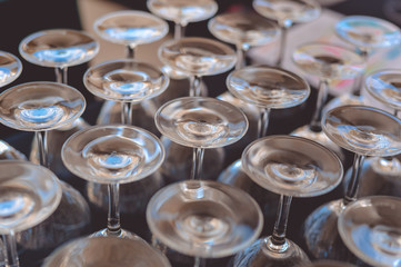 Catered service and tables ready for food eating event reception, busy light background