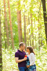 Caucasian pregnant woman and her husband outdoors