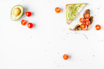 sandwiches set on white table background top view space for text