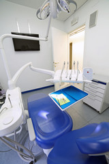 Dental clinic with special chair and dental care equipment photo