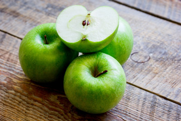 green apples for healthy dessert on wooden background