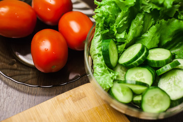 Fresh vegetables. sliced cucumber and tomato with lettuce