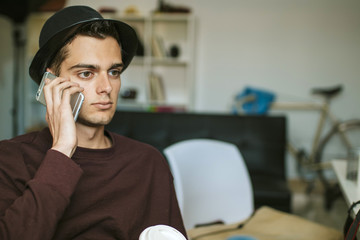 young man in casual style with the mobile phone