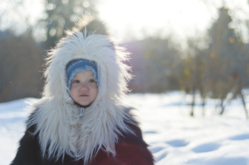 Portrait of a Girl in black and white fur coat fox