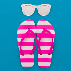 Beach season is open. Marine style. Flip-flops, stripes, sunglasses. Minimal art