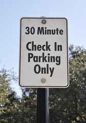30 minutes check in parking only sign
