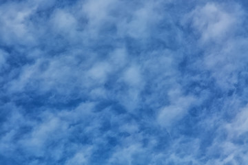 Fototapeta premium Blue sky with tiny clouds as a background