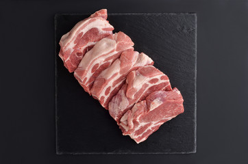 Five fresh raw boneless pork shoulder butt slices
