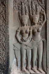 Angkor Wat temple. Sstone carving of Apsara dancers. Siem Reap, Cambodia