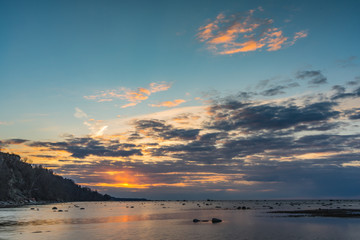 Beautiful sunset over Baltic sea with dramatic clouds, Long Exposure