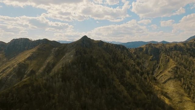 A flight over a beautiful valley with snowy mountains in the distance