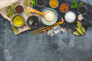 Rice and Food Ingredients over dark rustic background. Vegetarian concept. Asian or Indian food