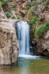 Obraz na płótnie Canvas Waterfall in Quebrada del Colorado canyon near Cafayate, Argentina