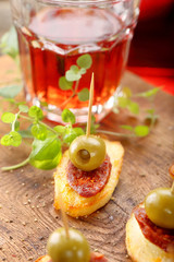 Baked potatoes spanish snack with sausage chorizo and green olive