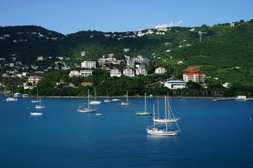 Fototapeta na wymiar View of Long Bay, St. Thomas island, US Virgin Islands from water with multiple yachts and boats on the foreground