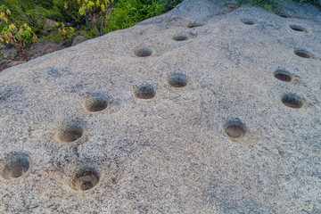 Ancient sacred site near Cafayate, Argentina. Holes in the rock represent stars of constellations.
