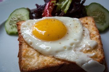 Sandwiches with white bread bacon and egg .