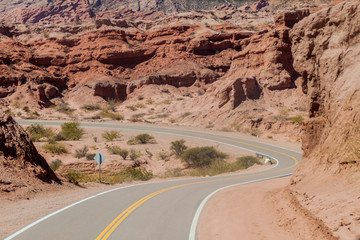 Road through Quebrada de Cafayate valley, which is full of colorful rock formations, northern Argentina.