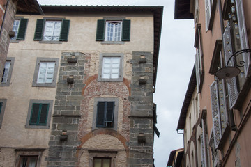 Fototapeta na wymiar Fragment of old building in Lucca. Italy.