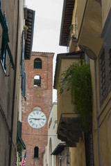 Antique clock tower in Lucca. Tuscany. Italy.