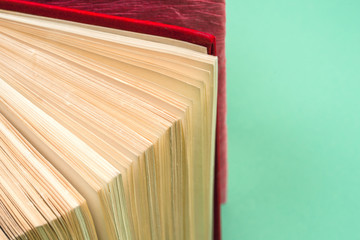 Top view of bright colorful hardback books in a circle.