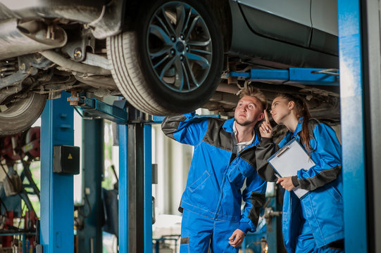 Man and woman in auto mechanics