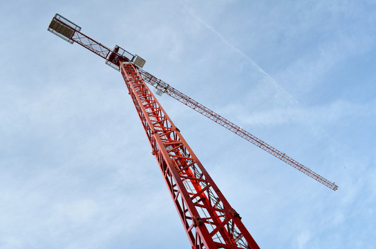 Red crane with sky in background, view from below