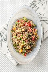 Top flat view of quinoa salad. Quinoa salads are very healthy and easy to do! Quinoa is a grain that originate from South America, it’s often called a super food due to its high nutritional content.