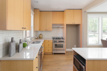 Kitchen in New Home with Oven, Microwave and New Cabinets
