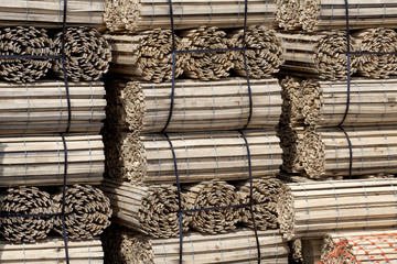 Rolls of dune fencing stacked