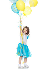 Fototapeta na wymiar Little girl with multicolored balloons.